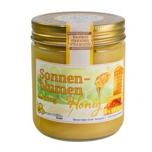 Sonnenblumenhonig im Glas mit goldenem Schraubdeckel